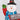 Snowman with blue scarf holding "Merry Christmas" sign